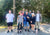 A group of people acting goofy at the trailhead after a group hike.