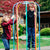 Two young boys playing on the merry-go-round