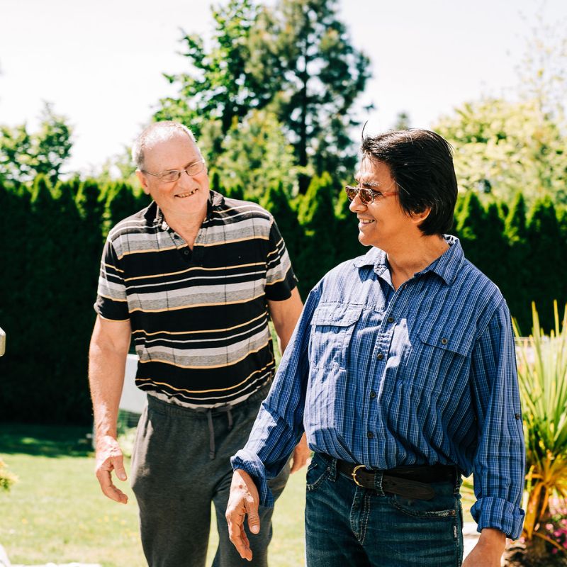 An older man and younger man out on a walk together