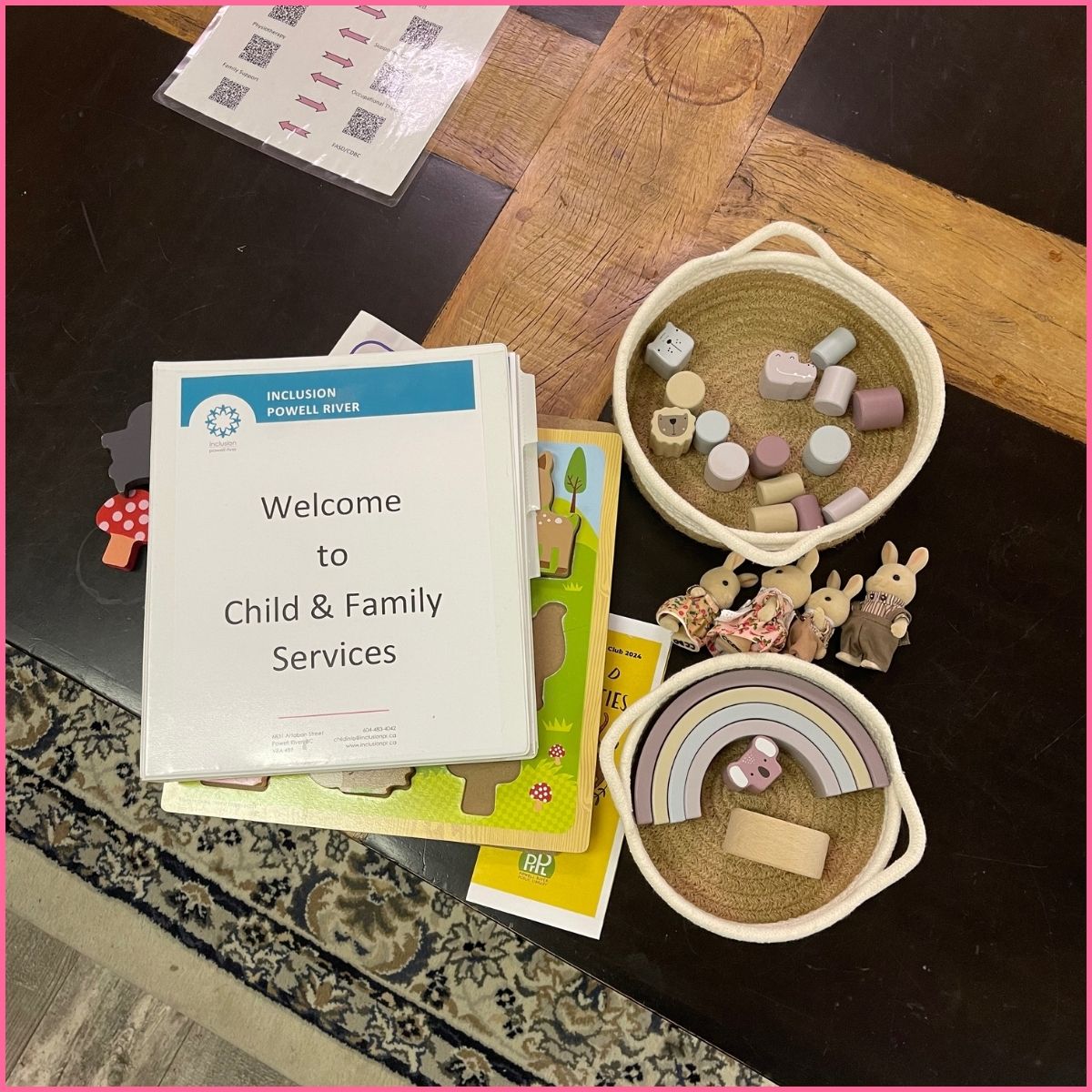 Image of some children's toys and a booklet titled Welcome to Child and Family Services