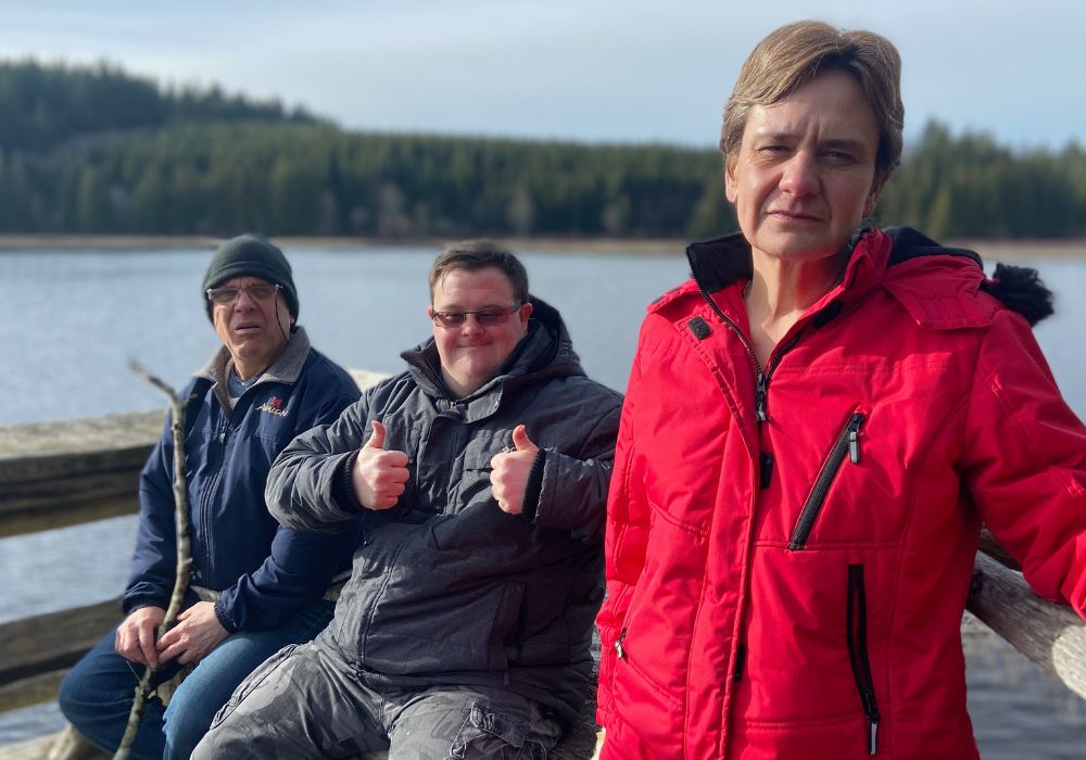 Three adults with intellectually disabilities out on an adventure