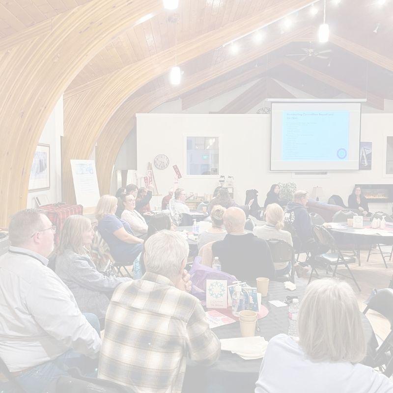 People voting at inclusion powell river's AGM
